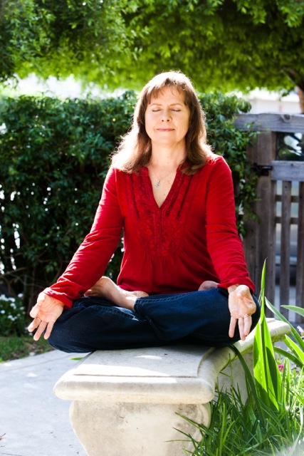 Joanne meditating outdoors