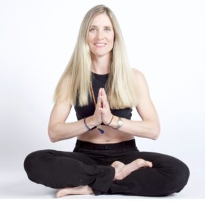 Bridget smiling in lotus