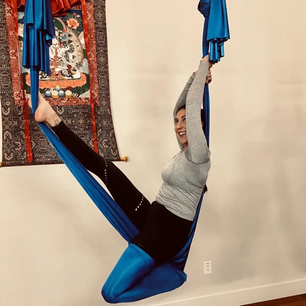 Yoga teacher, Cristina, in an aerial sling