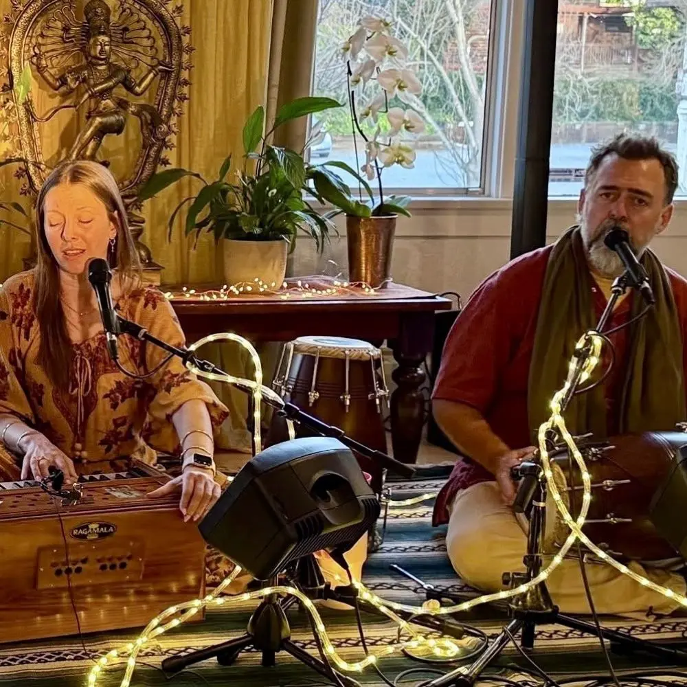 Prajna Vierie and David Estes singing during a Kirtan.