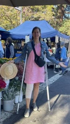 Marcela on crutches at farmers market