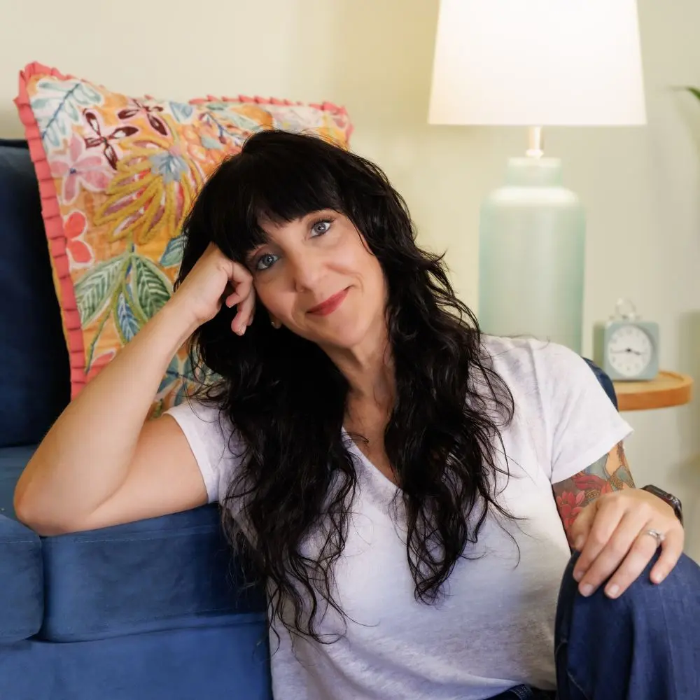 Noell Clark seated and smiling