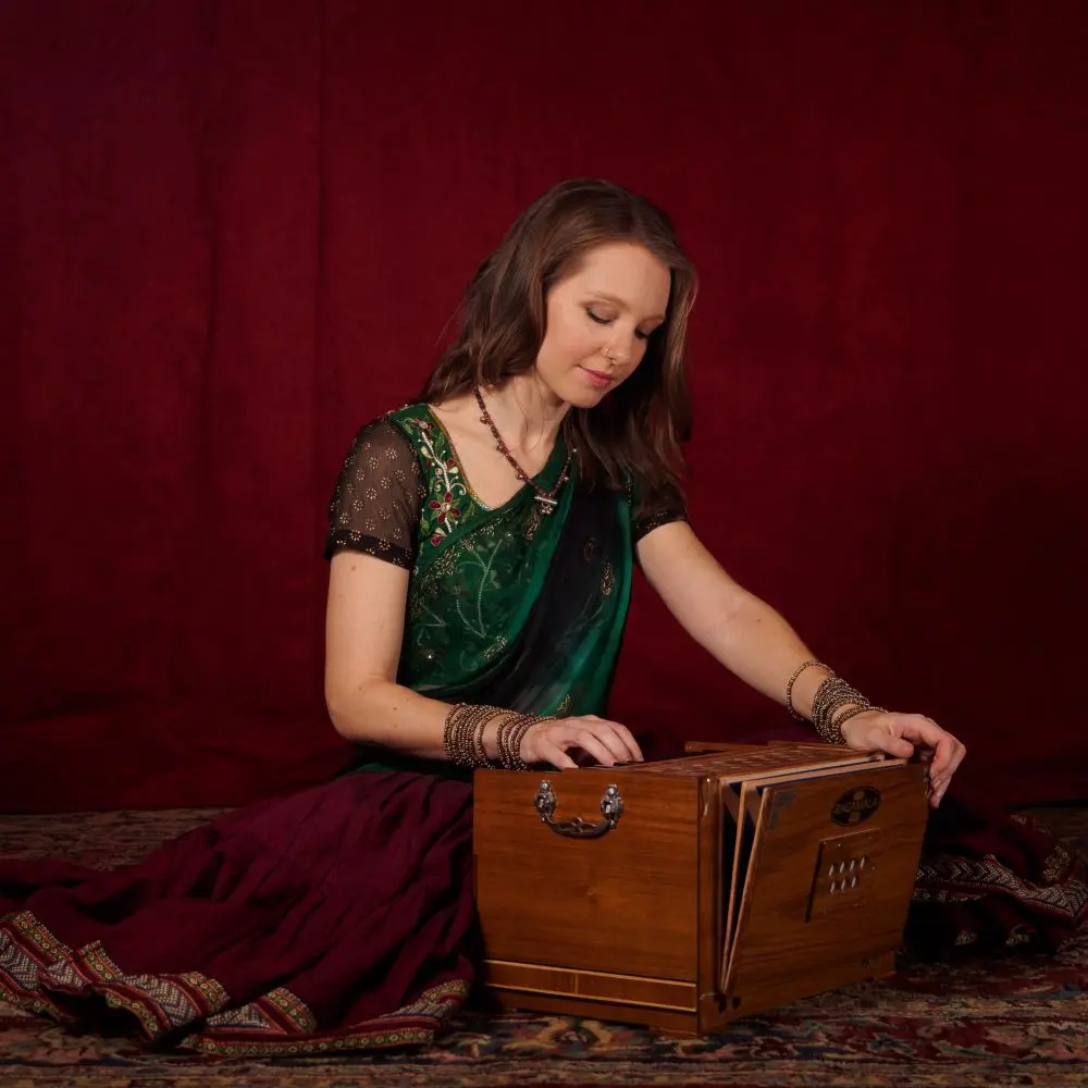 Prajna playing a harmonium