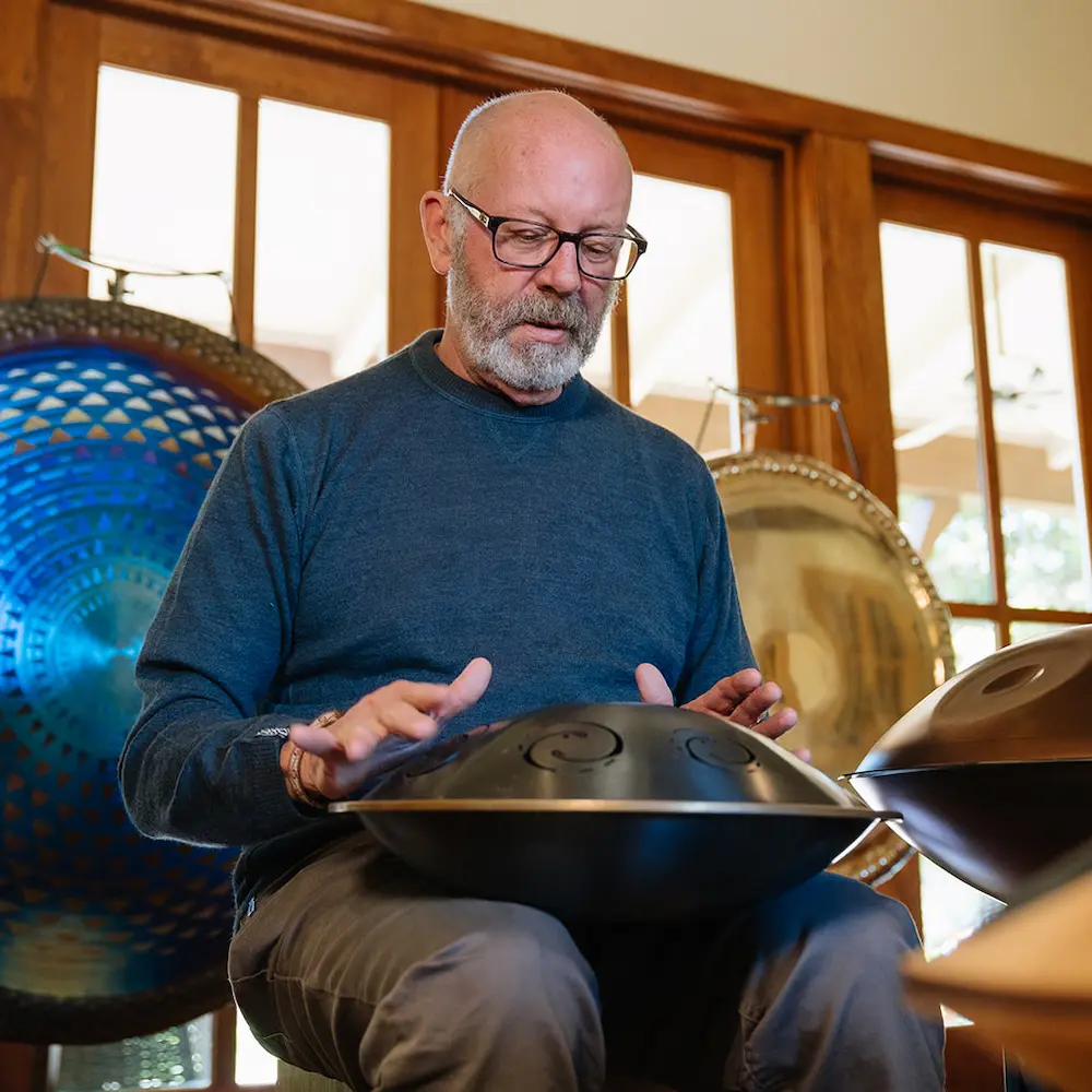 adron playing a handpan