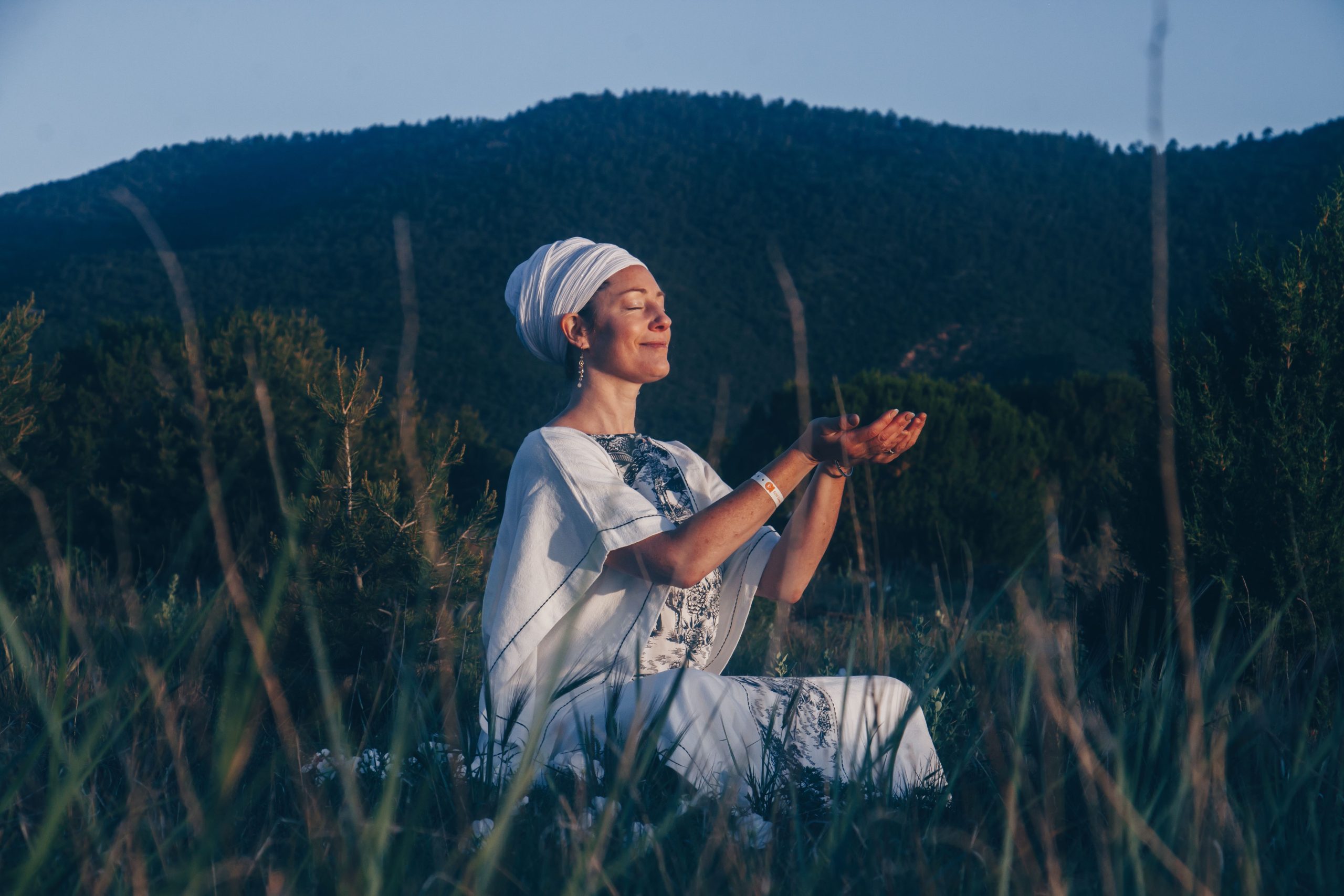 Noami sitting in a field