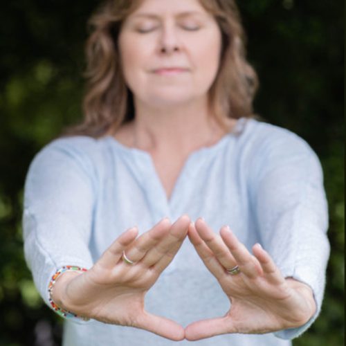 Joanne practicing a qigong asana
