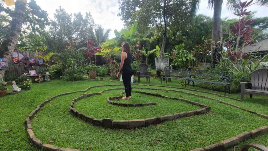 Rebekah basks in the gardens at Ram Dass' property