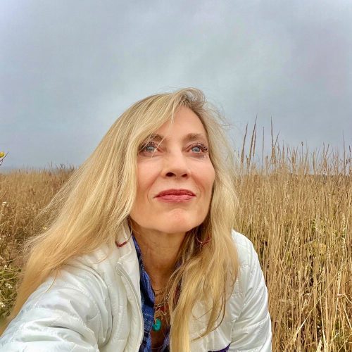 Jennifer Prugh in a field, looking up