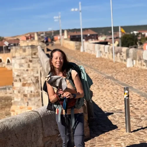 Jill Lacher walking on a bridge