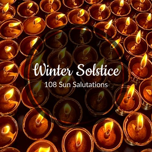 small, burning oil lamps close together with overlaid text "Winter Solstice 108 Sun Salutations"