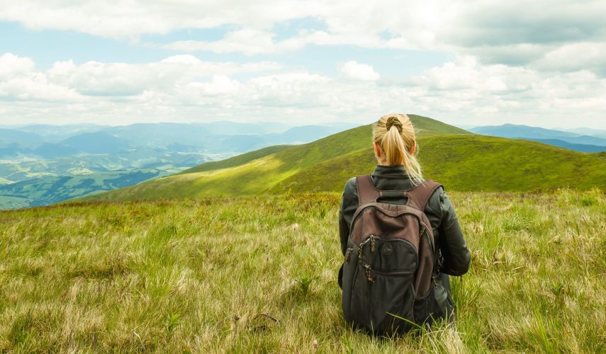 Female tourists sitting alone on the mountain