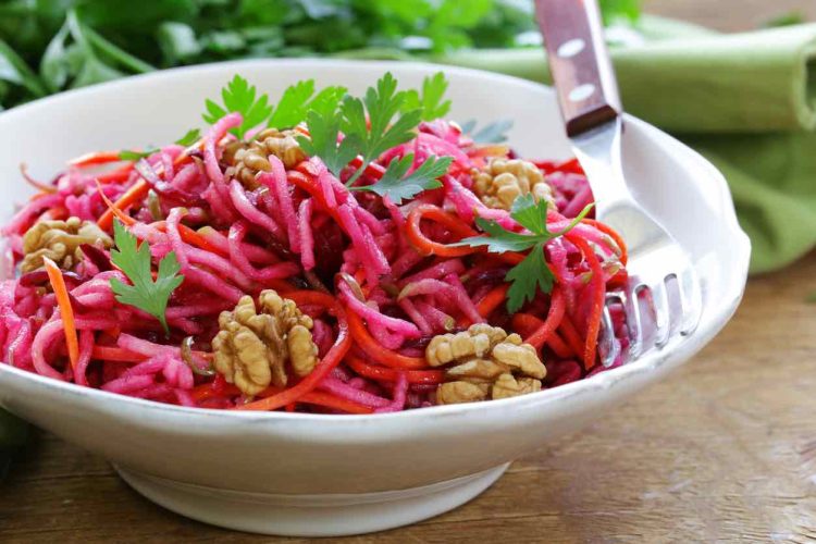 Salad with carrots, beetroot, apple and walnuts