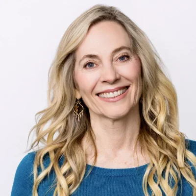 jenn prugh smiling with a blue shirt