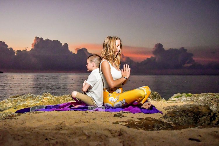 Katie and child meditating