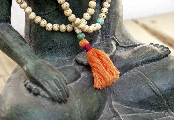 buddha statue with mala