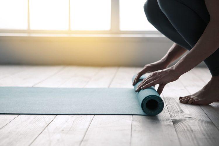 rolling up yoga mat