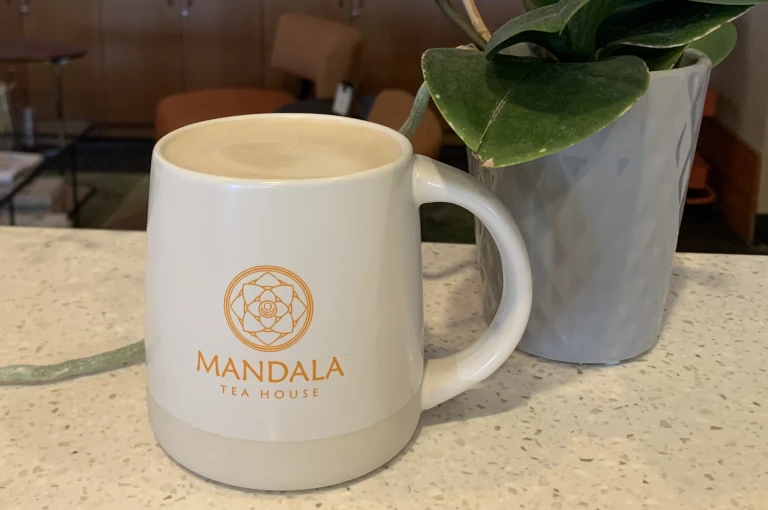 vanilla tea latte in a mandala tea house branded white mug