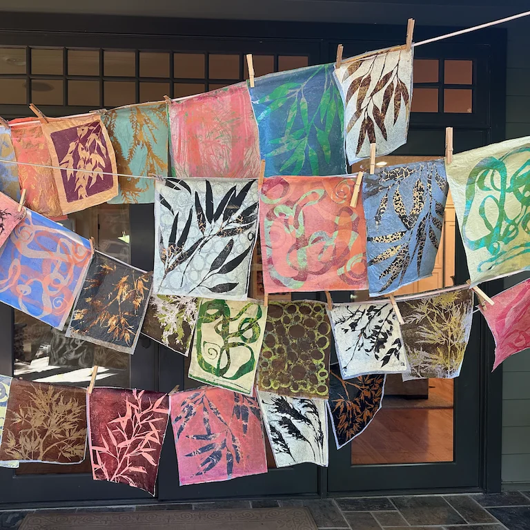 homemade paper decorated and hung on string