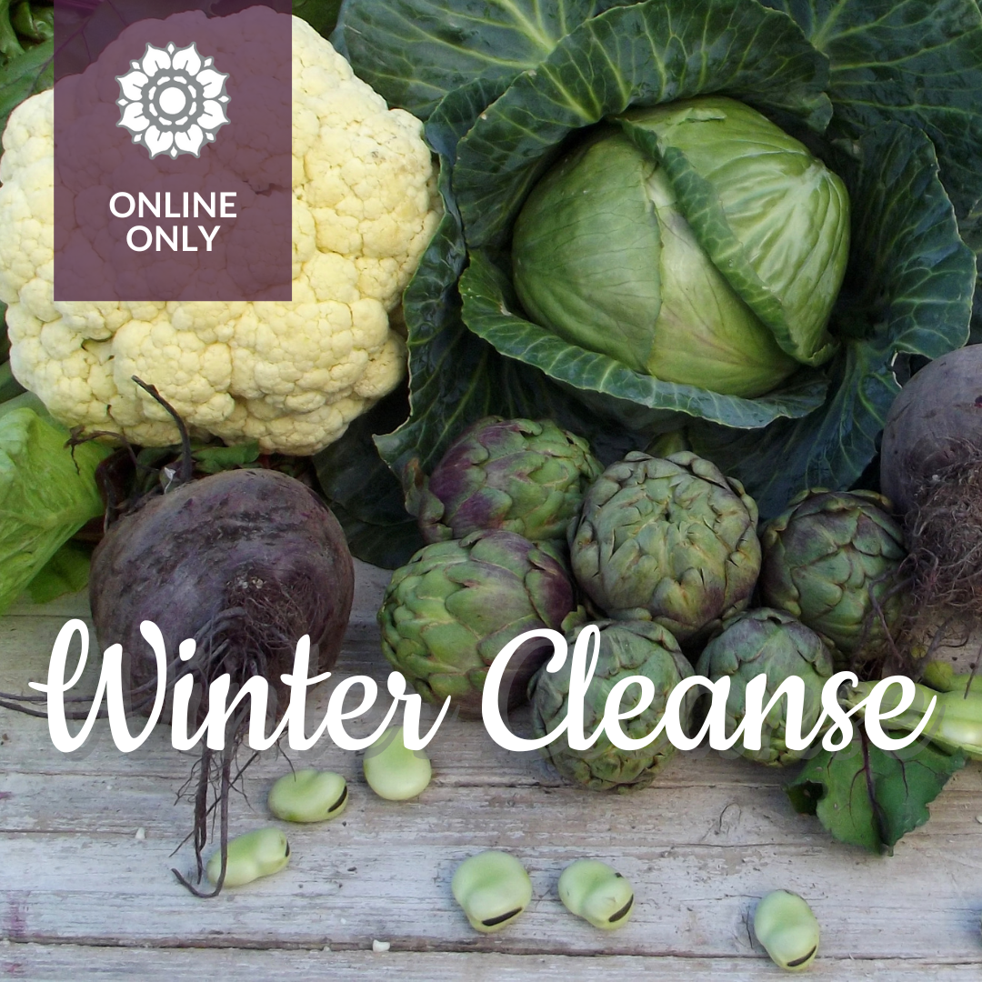 Cauliflower, cabbage, beats and brussel sprouts on a wooden slats with the phrase "Winter Cleanse".